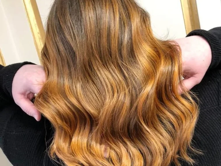 Long waves with golden balayage colour by Abi Clark, Horsham, West Sussex